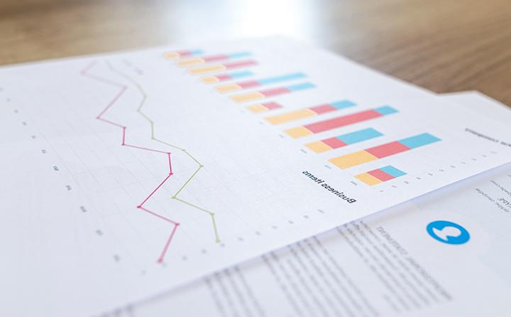 Photo of printed charts and documents on a table