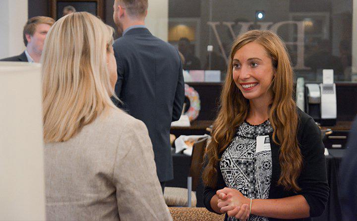 Photo of two women talking at an event