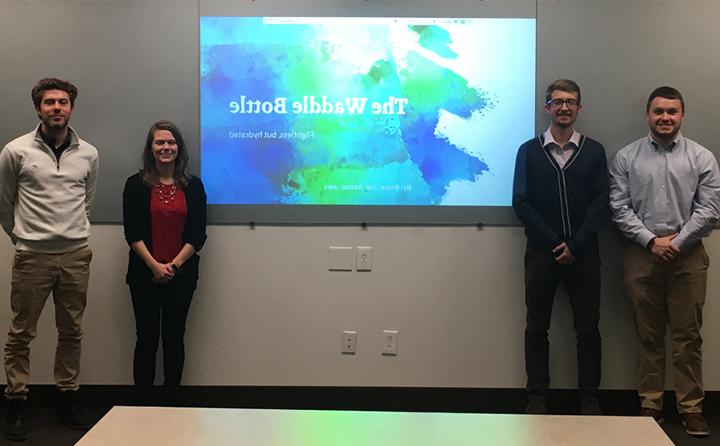 BW Sustainability students standing in front of presentation screen.